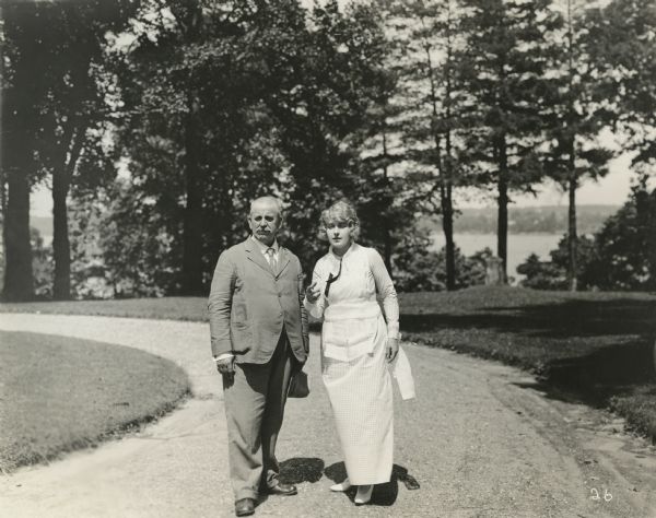 Silent film actress Pearl White outdoors with her father Edgar White.