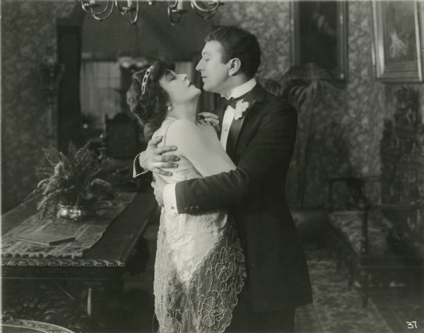 Roma Winnet and Bob Lawson (played by Virginia Pearson and Irving Cummings) embrace in a scene still from "Wrath of Love."