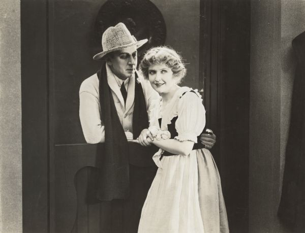 Walter Percival and May Allison in a scene still from "Almost Married."