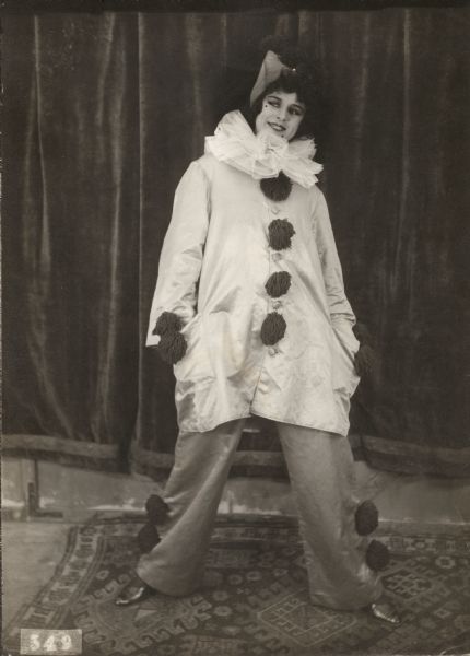In this scene still for "Back to Broadway" (Vitagraph 1914), Anita Stewart poses with her hands in her pockets as the clown Pierrot.