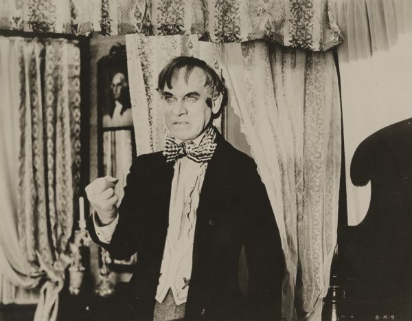 Louisiana doctor Dudley Duprez, played by Frank Keenan, makes a fist and glares angrily in a scene still for "The Bride of Hate," a drama of miscegenation in the Old South.