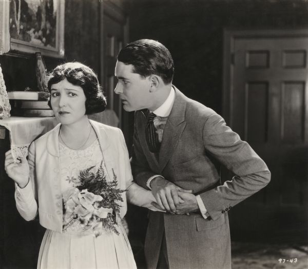 Nellie Steel, a cabaret dancer played by Florence Vidor, and Dick Revel, the young man who loves her (Lloyd Hughes), are having a crucial conversation in this scene still for the silent drama "Beau Revel."