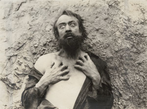 In the title role for the silent drama "The Beggar of Cawnpore," the actor H. B. Warner poses in character as Dr. Robert Lowndes, a British army doctor in India reduced to wild eyed beggary by morphine addiction.