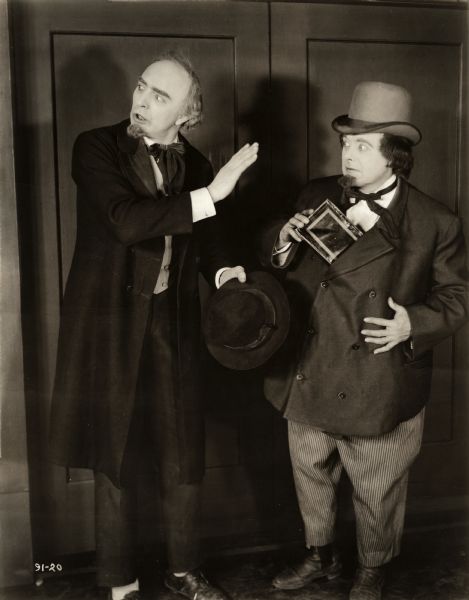 Louie Vanderiff (played by Clarence Kolb at left) and Mike Amsterdammer (Max Dill) pose in street clothes in a scene still for the 1917 silent comedy "Beloved Rogues." Kolb and Dill were a "Dutch act" vaudeville team similar to the more famous pair Weber and Fields.