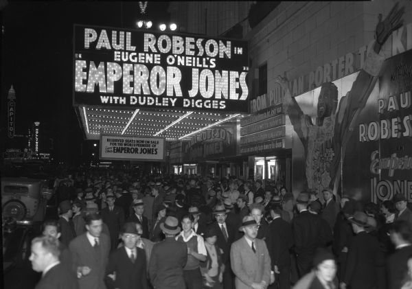 Crowded night-time scene in front of New York's Rivoli theater for the world premiere of the 1933 film "The Emperor Jones."
