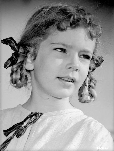 Child actress Ann Carter is costumed as Olga Pavlov in a publicity still for the 1943 production "The North Star."