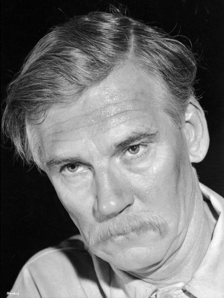 Walter Huston costumed as Dr. Pavel Kurin poses for a publicity still for "The North Star."