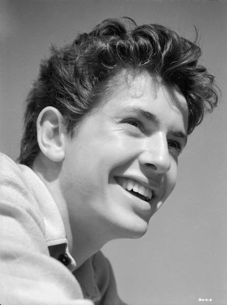 Farley Granger smiles broadly in a publicity still for "The North Star."