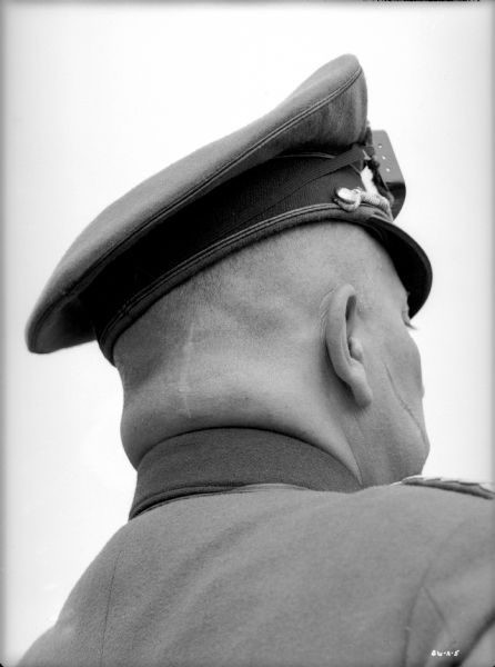 Erich von Stroheim faces away from the camera costumed as the German military doctor Otto von Harden in a publicity still for "The North Star." The unusual angle shows a long scar on the back of his head (probably a real one) and another scar on his right cheek (applied by a make-up artist).