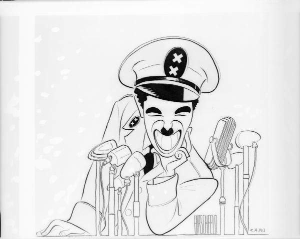 Al Hirschfeld's drawing shows Charlie Chaplin's Hynkel, the dictator of Tomania, behind a cluster of microphones, smiling broadly.