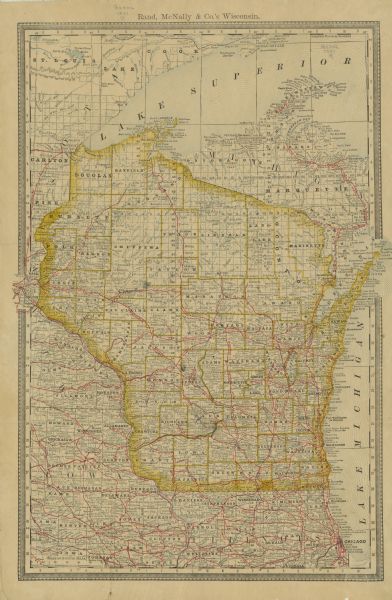 Map of Wisconsin including the eastern portions on Minnesota, Iowa, northern Illinois, and the western most portion of Michigan’s Upper Peninsula, showing railroads, marked by red lines throughout these areas. The map also includes the locations of post offices, railroad stations, and lighthouses and harbors along the coasts of Lake Superior and Lake Michigan.