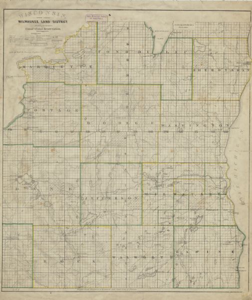 This hand-colored map shows the township and section grid in southeastern Wisconsin, covering the area west to Sugar River and Four Lakes region and north Lake Winnebago. Rivers, lakes, prairies, marshes, roads and trails, counties, cities and proposed cities, and the route of the Milwaukee and Rock River Canal are depicted. 