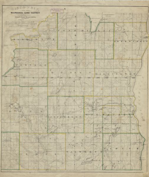 This hand-colored map shows the township and section grid in southeastern Wisconsin, covering the area west to Sugar River and Four Lakes region and north Lake Winnebago. Rivers, lakes, prairies, marshes, roads and trails, counties, cities and proposed cities, and the route of the Milwaukee and Rock River Canal are depicted.
