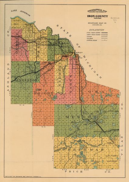 A map of Iron County, Wisconsin, shows color-coded townships, sections, lakes and streams, villages, railroads, roads, tourist camps, and La Pointe and Lac Du Flambeau Indian reservations.
