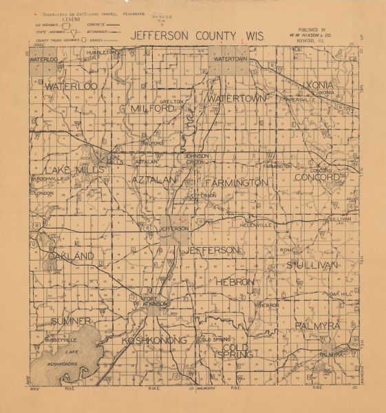 A road map of Jefferson County, Wisconsin, shows different types of roads, townships and sections, towns, railroads, and cities and villages. Cemetery locations are marked in red. It has been annotated to show the locations of cemeteries in red.