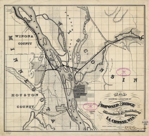 A map that covers parts of Winona and Houston Counties, Minnesota and La Crosse County, Wisconsin, showing the proposed railroad routes, constructed rail lines, marshes, general topography, and proposed bridge location on the Mississippi River at La Crosse, Wisconsin.