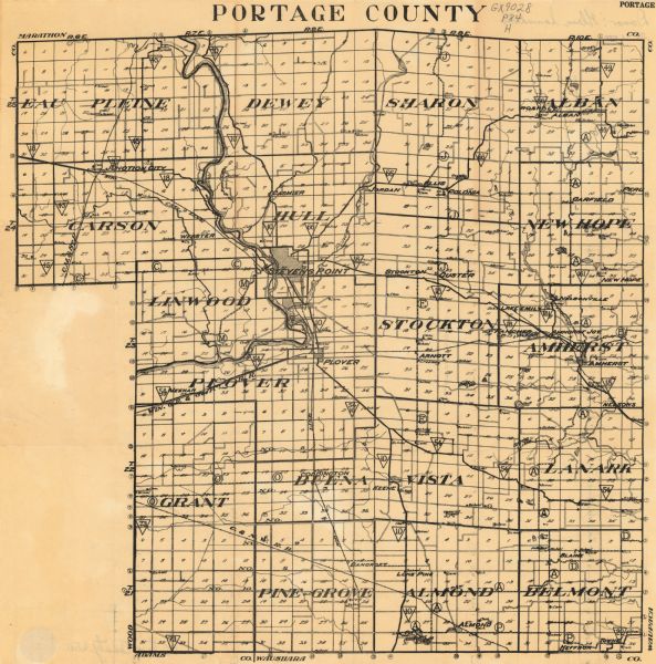 This map from the early 20th century shows the township and range grid, towns, sections, cities and villages, railroads, roads, schools, churches, cemeteries, town halls, creameries, and streams and lakes in Portage County, Wisconsin.