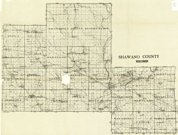 This map shows the township and range system, sections, schools, churches, cemeteries, town halls, roads, railroads, and lakes and streams in Shawano County, which at the time included the Menominee Indian Reservation.