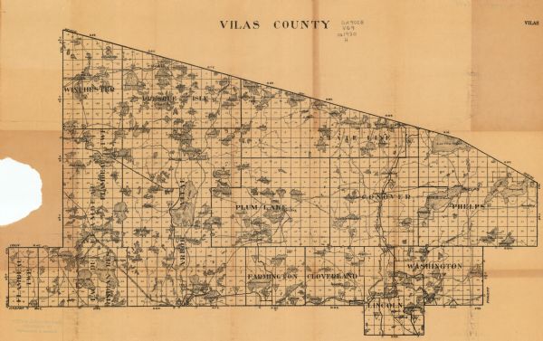 This map of Vilas County, Wisconsin, from the first half of the 20th century, shows the township and range grid, towns, sections, cities and villages, roads, railroads, and lakes and streams.