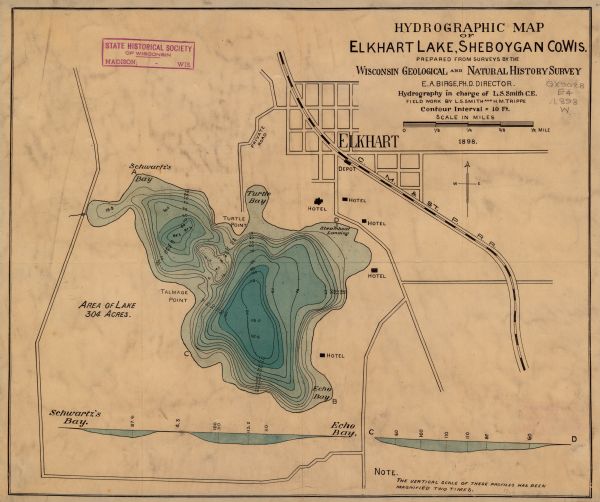 This map shows the contour depths of Elkhart Lake in the Town of Rhine, Sheboygan County, Wisconsin, and includes two cross sections of the lake. The village of Elkhart Lake, the railroad, roads, and hotels in the area are shown. 
