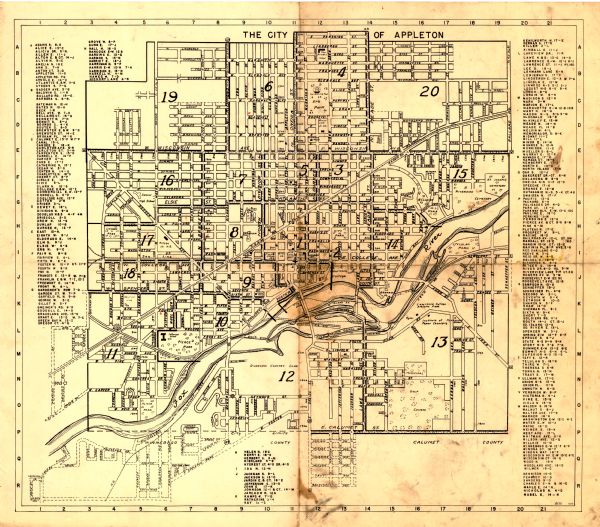 Map shows roads, highways, railroads, parks, city buildings, schools, cemeteries, city limits, and the Fox River. The map is indexed by street name, street lists appear on the left, right, and bottom of the map. The lower right margin reads: "8/52 H.J.C."