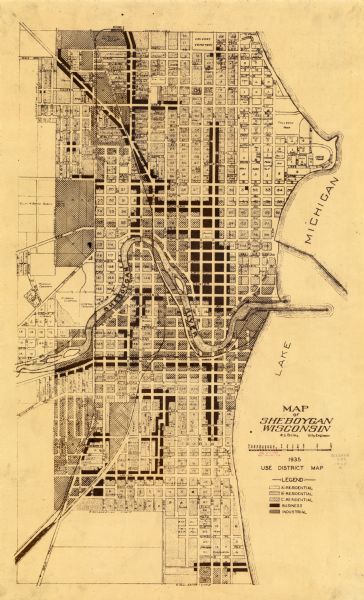 This map created by the Sheboygan City Engineer department shows five different types of land use in the city in 1935. A legend in the bottom right corner specifics that land types as 'A'-Residential, 'B'-Residential, 'C'-Residential, Business, and Industrial. Streets are labeled on the map as well as the Sheboygan River, Lake Michigan, and some points of interest. The map appears to have been compiled by A.L. Boley, a city engineer. The map is printed in brown ink.