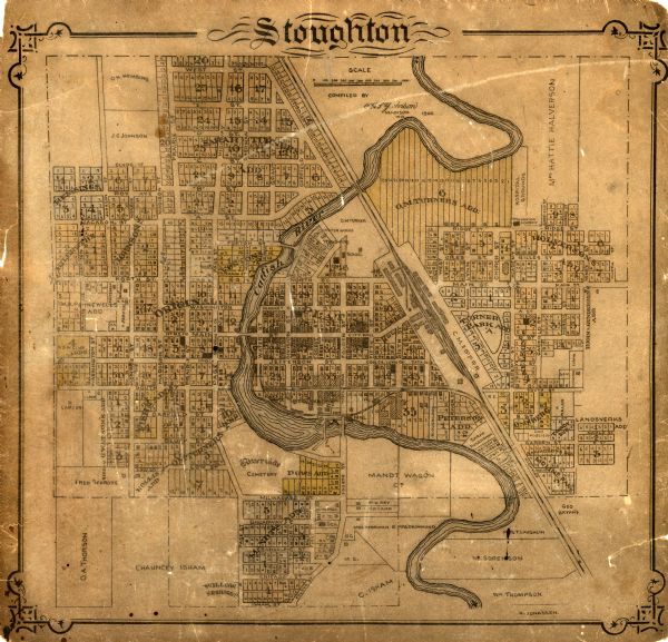 This map of Stoughton shows plat additions, numbered lots, some land ownership, and labeled streets. The map is color coded in blue, pink, and yellow although very faded. The Carfish River runs through the middle of the map and is labeled.