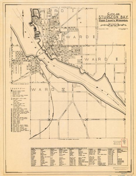 This map of Sturgeon Bay shows section and quarter corners, ward divisions, government building locations, roads, and railroads. The map includes a legend of points of interest and a table of present and former street names.