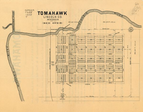 This map of Tomahawk shows the Wisconsin River, numbered lots, and labeled streets. The back of the map reads: "Henry C. Payne, 424 Broadway, - - Milwaukee. For the Tomahawk Land and Boom Company." The back of the map provides a description of Tomahawk.