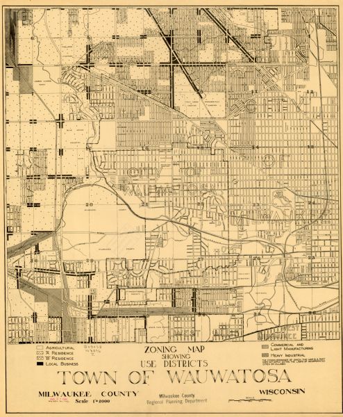 This is a zoning map of Wauwatosa with a key of districts including agricultural, resident, business, commercial, and industrial. The map features labeled streets and some points of interest. "Milwaukee County Regional Planning Department" is stamped under the title.