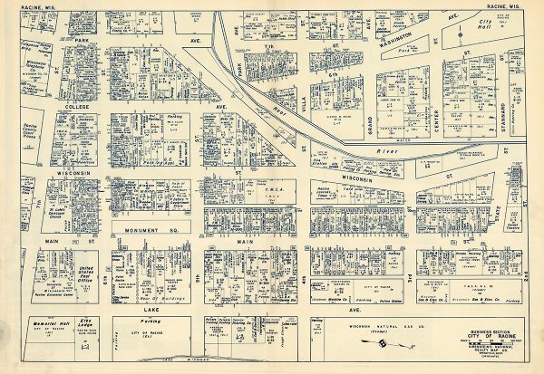 This map of Racine's business section is oriented with the north to the right and shows businesses and lot owners. Businesses, streets, and the Root River are labeled. The back of the map includes text and illustrations.