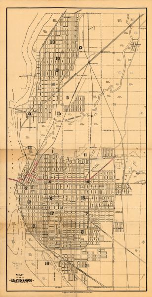 This map of La Crosse shows twenty wards, some rural lots with acreages, streets, railroads, depots, bridges, cemeteries, parks, schools, islands, and the Mississippi River. There is a manuscript annotation in red.
