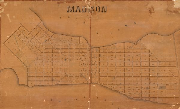 This map shows a plat of the city, local streets, numbered blocks and lots, university grounds, the Capitol Square, and parts of Third and Fourth Lakes (Lake Mendota, Lake Monona).