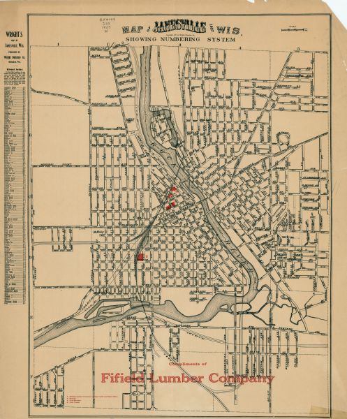 This map shows a plat of city, a numbering system, local streets, railroads, and part of the Rock River. The map is indexed by street name and reads: "Copyright 1927 by Wright Directory Co." and "Compliments of Fifield Lumber Company". The Fifield Lumber Company buildings are shown in red.