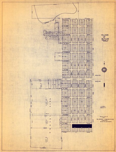 This map is revised by McMahon Engineering Company, Menasha, Wisconsin and shows plat of town, local streets, concrete monument, iron stake, government stone, township divisions, and block and lot numbers.