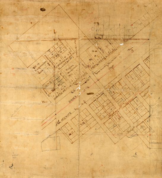 This map is pencil and ink on tracing cloth. The map shows plat of the town and local streets. There are some manuscript annotations in pencil and red ink.