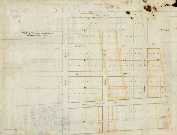 This map is ink, color, and pencil on paper and shows streets, farm lots, and a church. Handwritten notes are at the bottom of the map and are very light.