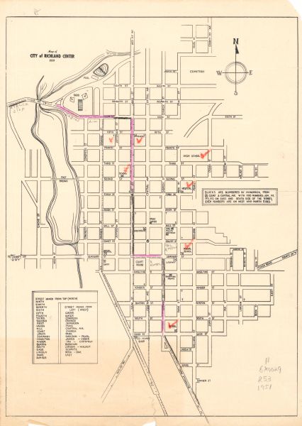 This street map shows public buildings and streets. The lower left corner includes a table of street names and the middle right includes text on the street numbering. There are pink and red manuscript annotations in what appears to be crayon.	

