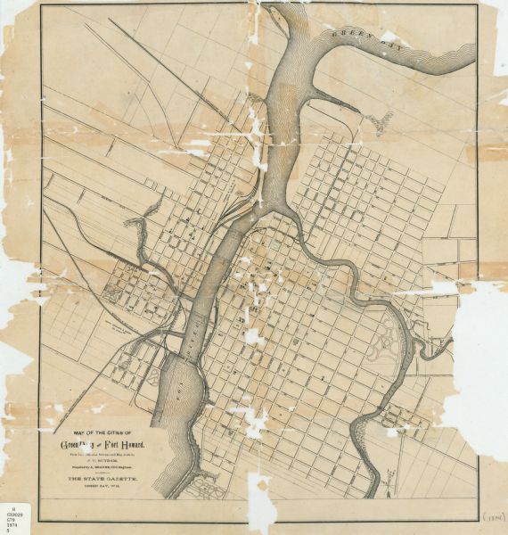 This map shows streets, buildings, railroads, the Fox River, the East River, and part of Green Bay.