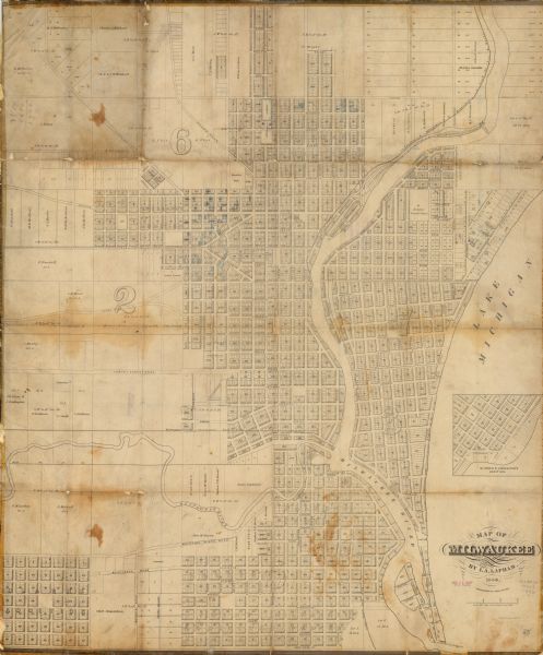 This map shows lot and block numbers, wards, roads, railroads, and some landowner names. Lake Michigan and the Milwaukee River are labeled. Includes an inset map of Glidden & Lockwood’s addition, and some lots hand-colored blue.