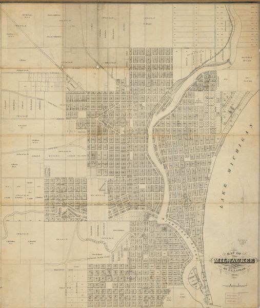 This map shows lot and block numbers, roads, railroads, and some landowners’ names. Lake Michigan, the Milwaukee River, and the Menomonee River are labeled. The map also includes pencil manuscript annotations.