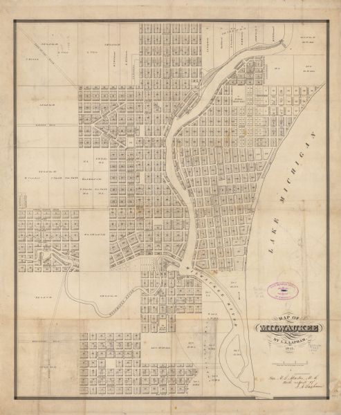 This map shows lot and block numbers, local streets, railroads, some landowners’ names, Milwaukee River, Menomonee River, and part of Lake Michigan. The map includes manuscript annotations: "John Catlin, esq. with respects of I.A. Lapham."