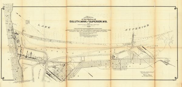 This map shows blocks, industrial buildings, and railroads in portions of Duluth and Superior, as well as harbor lines, areas improved, and proposed improvements "under present project" in Superior Bay, Allouez Bay, and part of St. Louis Bay. Depths are shown by soundings and isolines. North is oriented to the upper left. The top of the map reads: "Soundings are in feet and reduced to low water datum," and the bottom right margin reads: "To accompany my report for the fiscal year ending June 30th, 1898."
