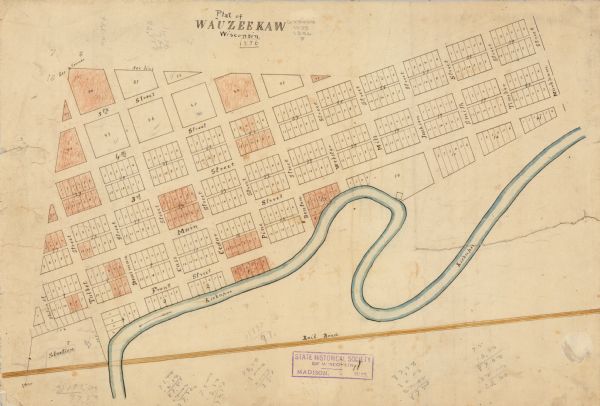 This map is ink and color on paper and mounted on cloth. The map shows lot and block numbers, streets, a railroad, and the Kickapoo River.  Some lots are colored and there are some manuscript annotations on the top and bottom margins. There are also certifications written on verso but they are obscured by cloth.