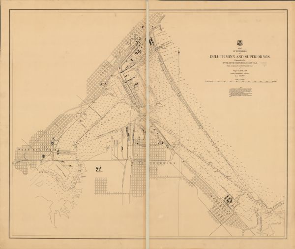 This map shows selected industrial buildings, streets, railroads, docks, and beacons in West Duluth, Duluth, West Superior, and Superior, as well as the St. Louis River channel and Superior Bay. Depths are shown by soundings and isolines.