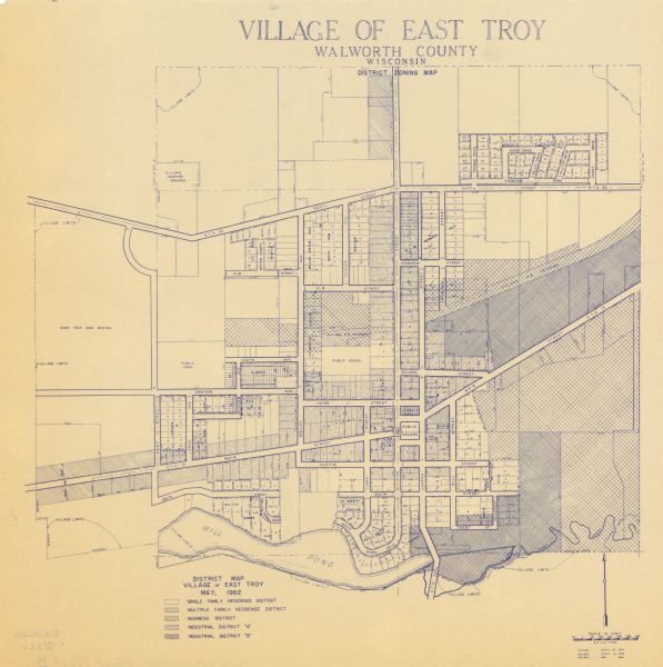This blue print map shows 5 zoning districts, as well as lot and block numbers and dimensions, public land, streets, and Mill Pond. The zones are: "Single Family Residence District", "Multiple Family Residence District", "Business District", "Industrial District 'A'", and "Industrial District 'B'".
	