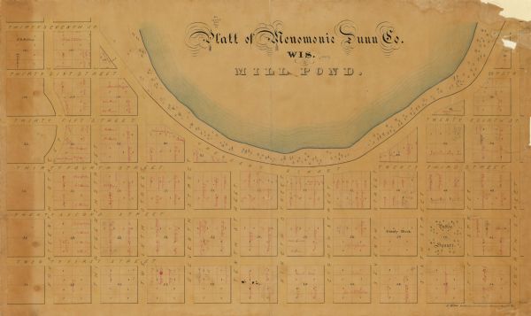 This plat map is pen, pencil, and watercolor on paper and shows numbered blocks and lots, local streets, section lines, the public square, Mill pond, and land ownership by name. The land owner's names are written in red ink.