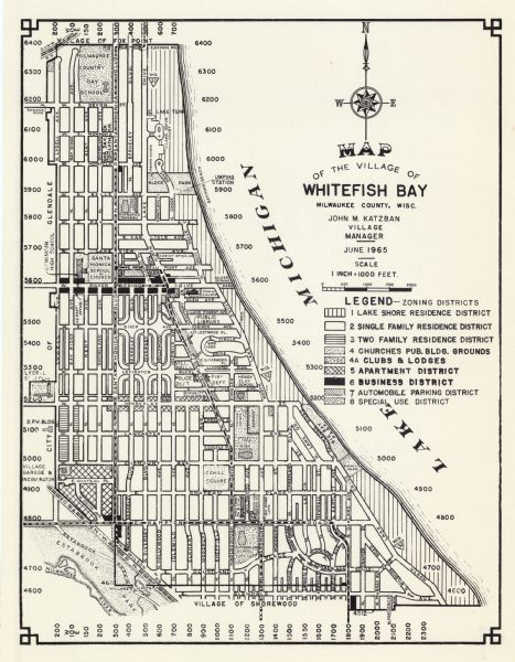 This map shows 8 zoning districts, as well as house number system, schools, parks, churches, and points of interest. Lake Michigan is labeled and the lower left corner includes a legend.