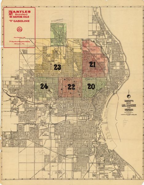 This map shows streets, railroads, parks, and cemeteries. The top right includes an advertisement for Bartles-Maguire Oil Co. Wards are colored in red, yellow, and green. Also included are manuscript annotations in pencil.