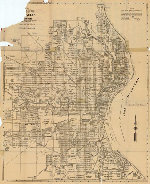 This map shows streets, railways, bus lines, railroads, roads, parks, cemeteries, Lake Michigan, and a proposed harbor. Also included is a legend and on the reverse a street index and text.